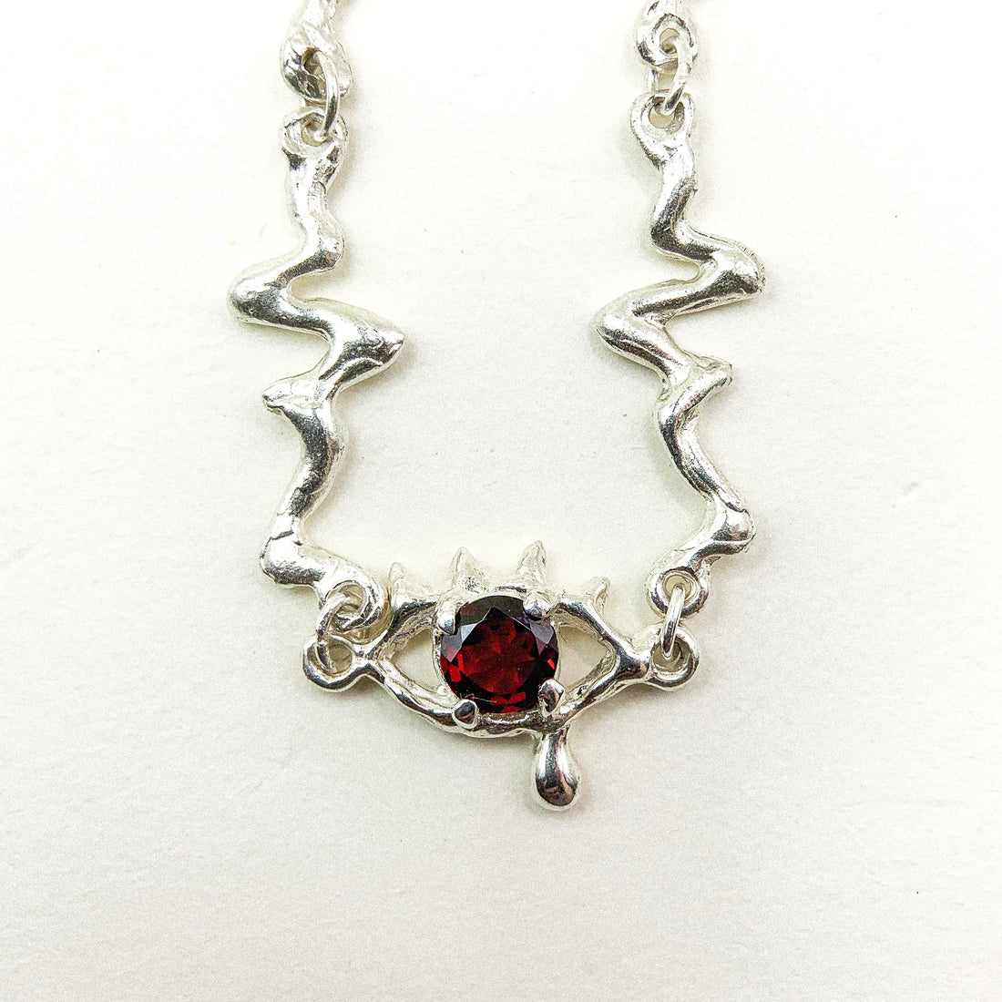 Garnet Eye Silver Necklace