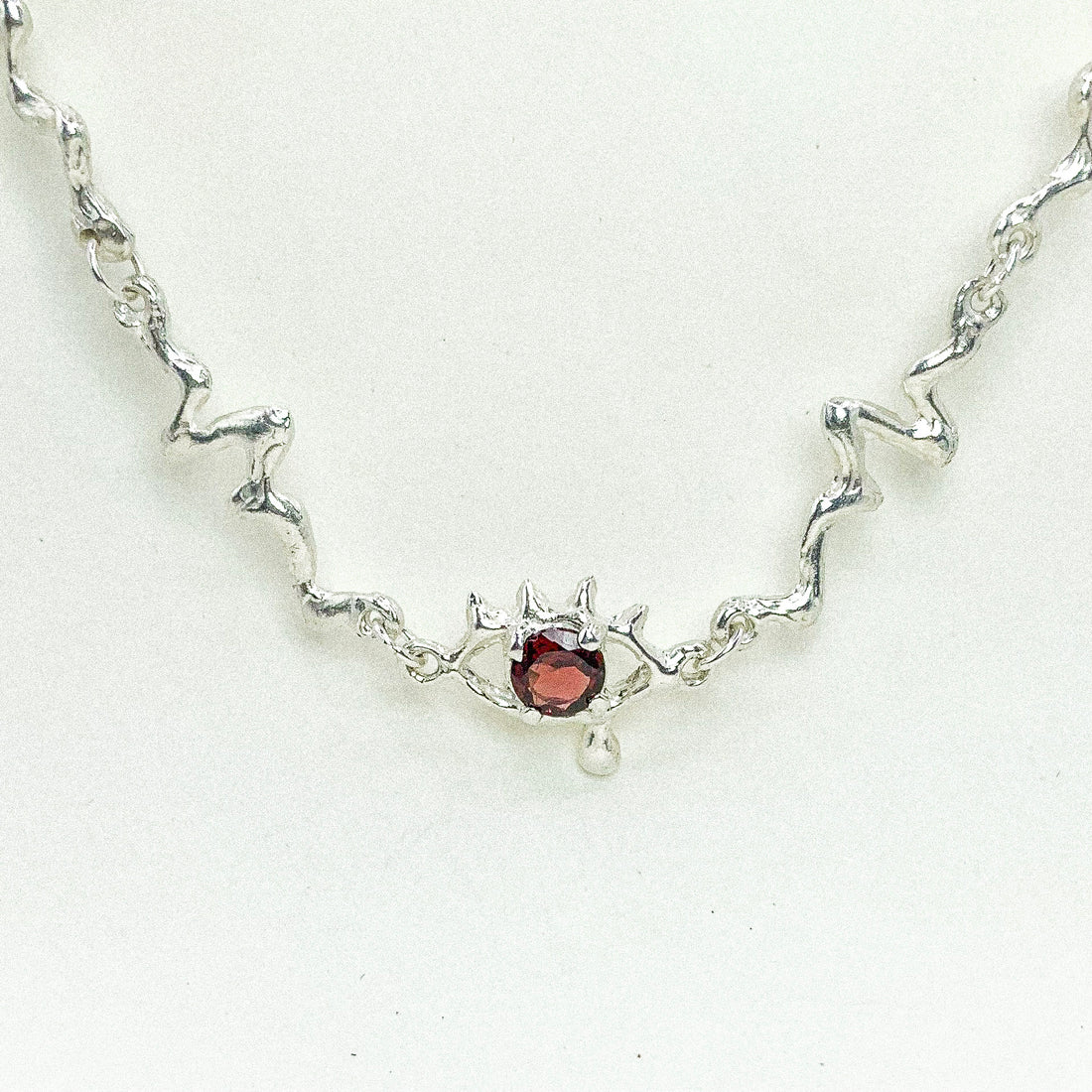 Garnet Eye Silver Necklace